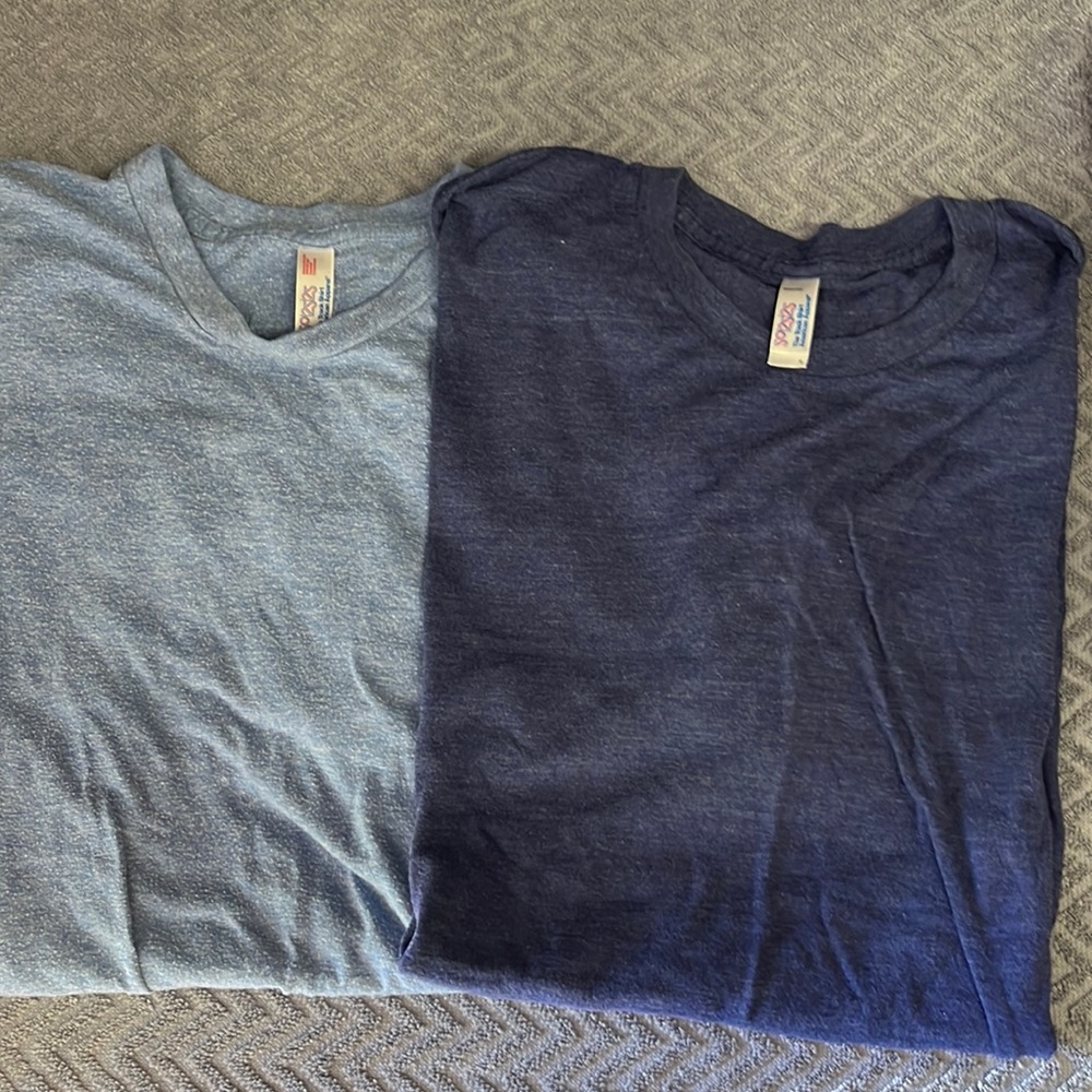 A pair of American Apparel 50/25/25 track shirt